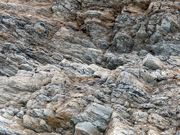 Beautiful rock, background. Stone layers close-up, full frame. Stone texture, rock formation.