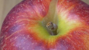 The big red apple is spinning, close-up video. Video in full hd format. Macro