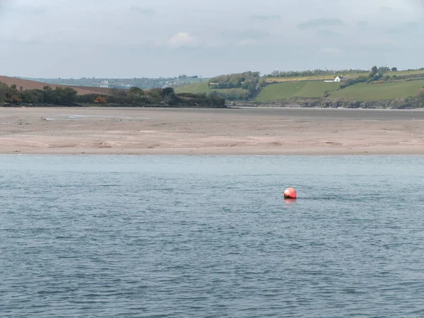 An sea buoy on the water. Seascape. Calm water surface. Body of water