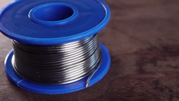 Blue Plastic Spool Tin Solder Macro Rotation — Stockvideo