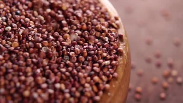 Full Wooden Bowl Raw Red Grain Quinoa Gluten Free Falling — Stockvideo