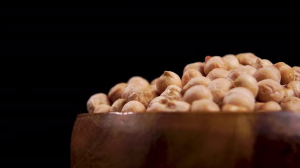 Dried Uncooked Chickpea Beans Wooden Bowl Black Background Macro Rotation — Stockvideo