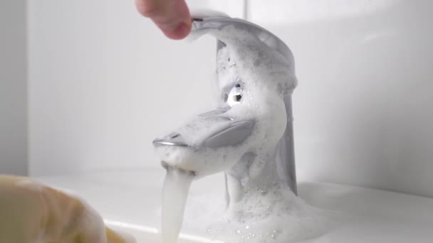 Squeezing Sponge Detergent Running Water Foamy Bath Faucet Slow Motion — Stock Video