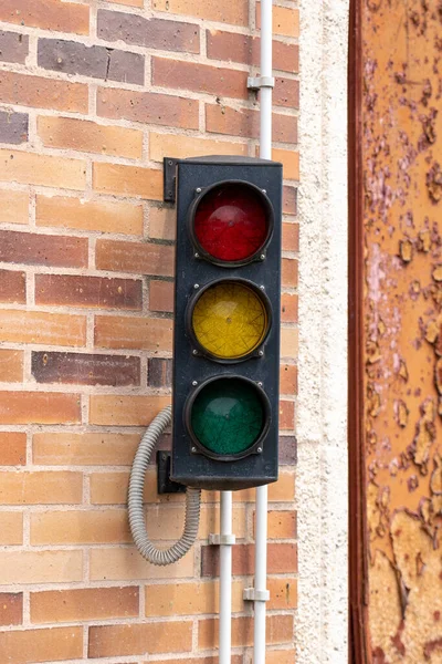 Old disabled non-working traffic light in the parking close-up