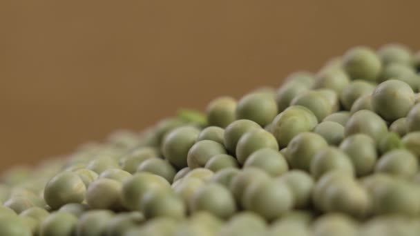 Dry Whole Green Peas Close Brown Background Macro Rotation — Stok Video
