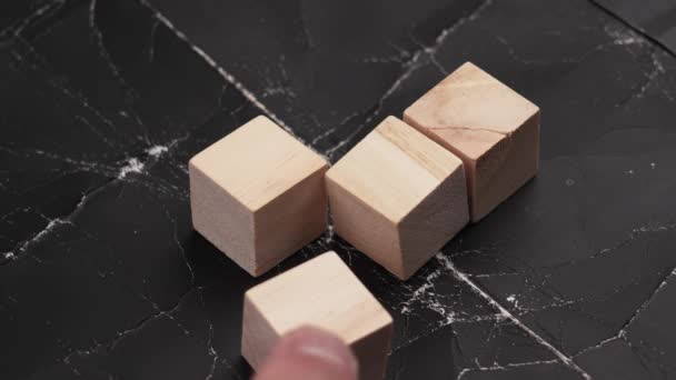 Creating Checkmark Wooden Toy Cubes Black Grunge Background Hand Moves — 图库视频影像