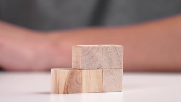 Hand Placing Green Toy Cube Top Tower Wooden Blocks Environmentally — ストック動画