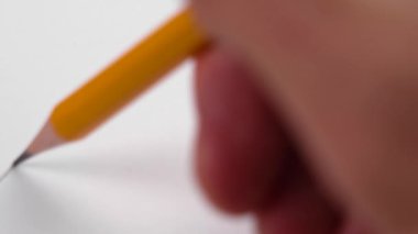Drawing a statistical graph of achievement growth and business development with a pencil on white paper. Chart of economic progress. The concept of financial success