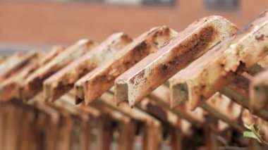 Old rusty metal prison fence with corroded texture closeup