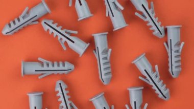 Yaratıcı renkli turuncu bir arka plana monte edilen plastik naylon tıkaçlar. Üst Manzara. Döndürme