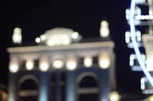 Дефокусований Знімок Будівлі Колеса Ферисом Освітлений Вночі — стокове фото