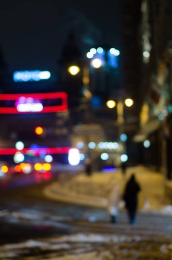 defocused night shot of bokeh lights at street