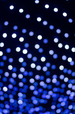 defocused night shot of festive bokeh lights 
