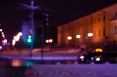 defocused night shot of bokeh lights at street
