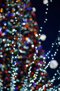 defocused night shot of festive bokeh lights 