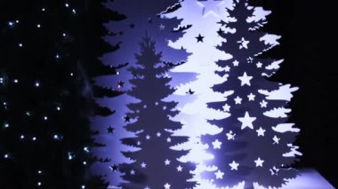 New Year and Christmas decorations are lit with garlands.