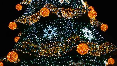 Colorful christmas lights garland. Abstract blurred christmas lights bokeh background.