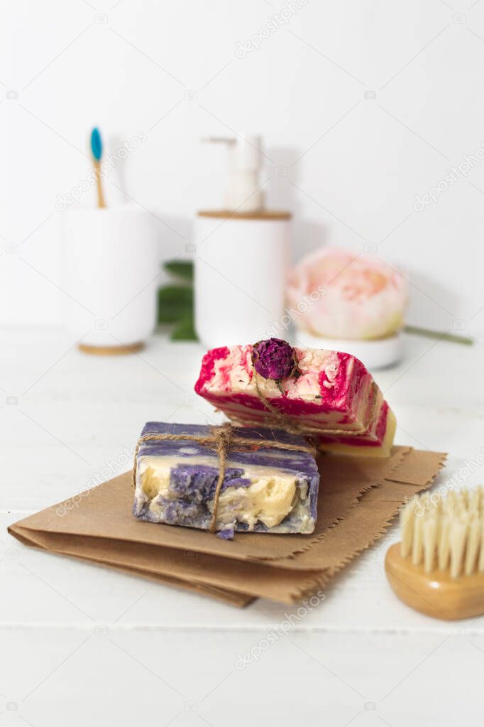Handmade natural soap with rose and lavender on wooden background