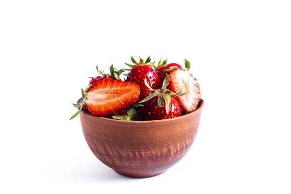 Fresh strawberries in a brown bowl on white background — Stock Photo, Image