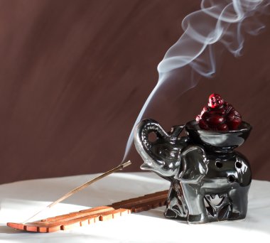 Aromatizing stick with figures of elephants and Buddhas