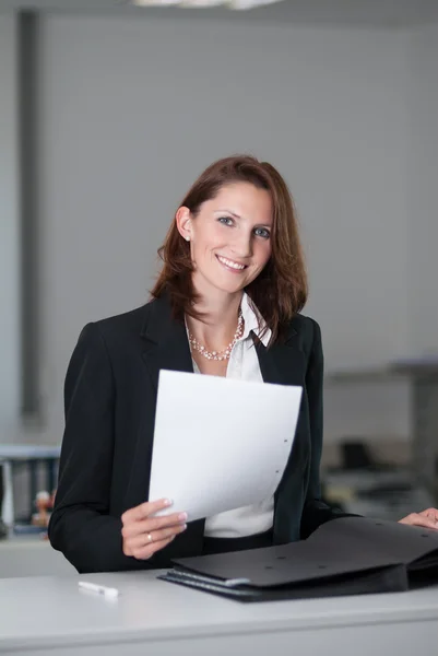 Businesswoman with a contract Royalty Free Stock Images