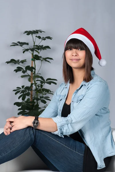 Young woman with a Christmas hat — Stock Photo, Image