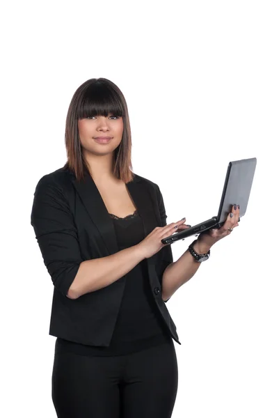 Woman types on a netbook — Stock Photo, Image