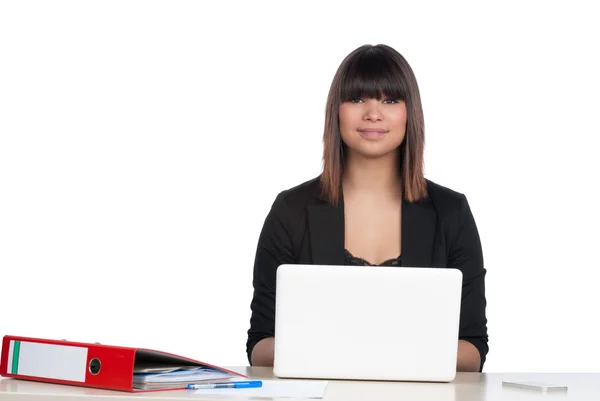 Woman sits in front of a notebook — Stock Photo, Image