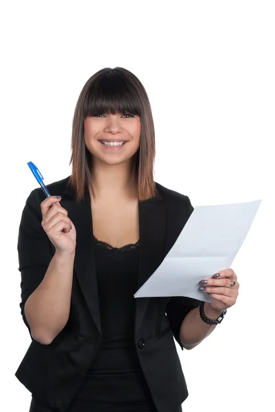 Woman holds a piece of paper and a pen — Stock Photo, Image