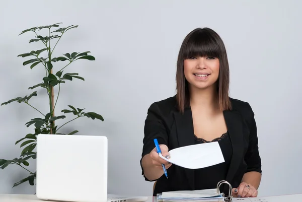 Woman hands over a sheet of paper — Stock Photo, Image