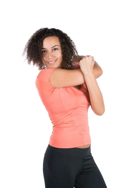 Young woman stretches her musculature — Stock Photo, Image