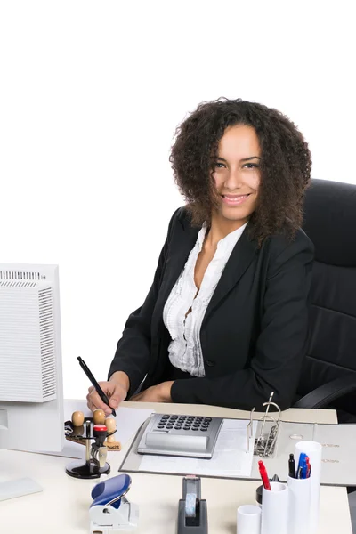 Young office worker writes — Stock Photo, Image