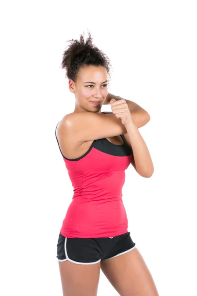 Young woman stretches her musculature — Stock Photo, Image