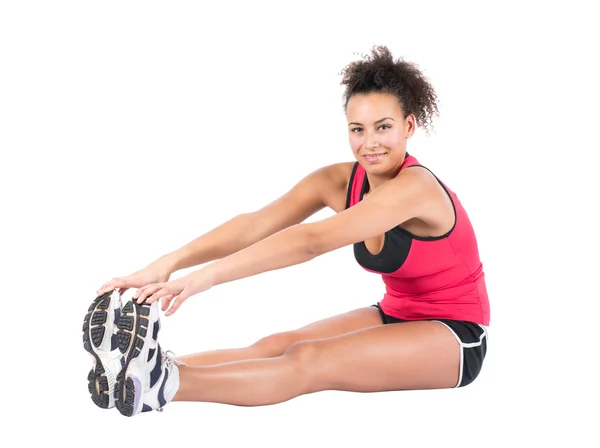 Young woman stretches her musculature — Stock Photo, Image