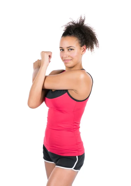 Joven mujer estira su musculatura Fotos de stock libres de derechos