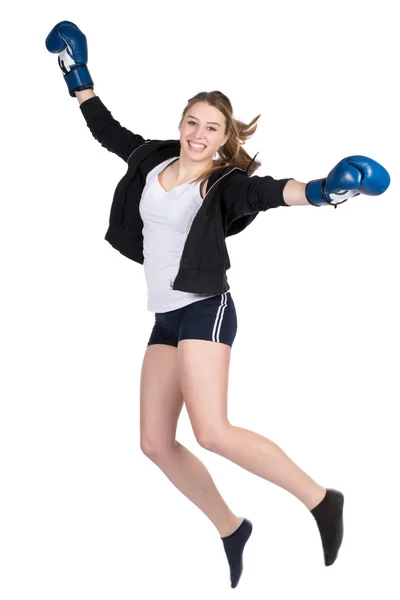 Joven sonriente boxeador femenino saltando Imágenes de stock libres de derechos