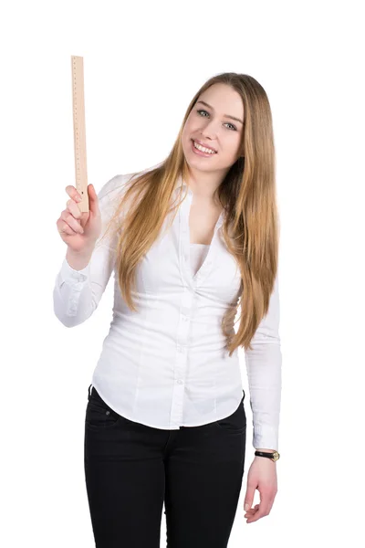 Young woman holds a ruler — Stock Photo, Image