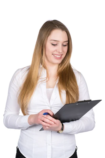 Young woman looks at a clipboard — Stock Photo, Image