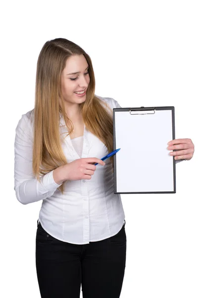 Young woman points to a clipboard with a pen — Stock Photo, Image