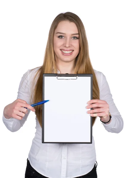 Young woman points to a clipboard with a pen — Stock Photo, Image