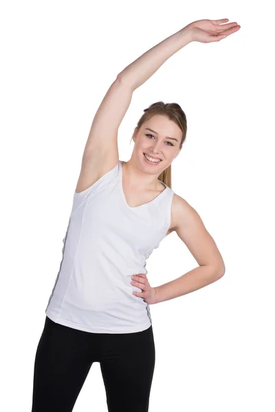 Young woman stretches her musculature — Stock Photo, Image