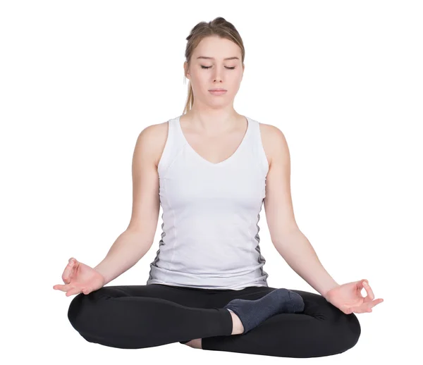 Young woman sits on the floor and meditates — Stock Photo, Image