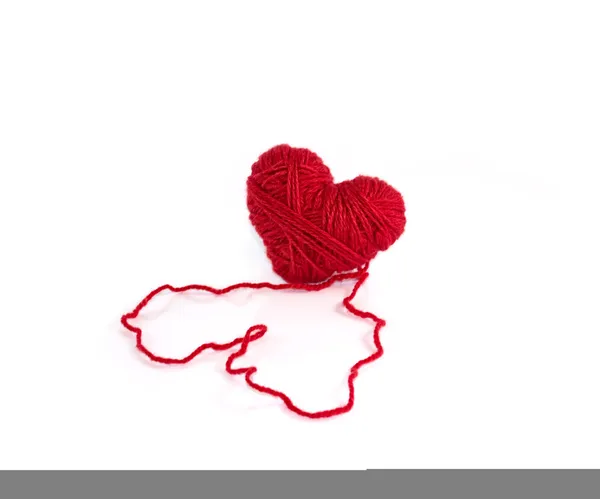 Heart made of red wool yarn — Stock Photo, Image