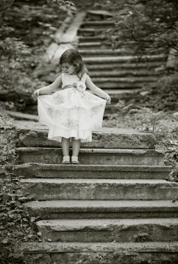 Beautiful girl on the stairs clipart
