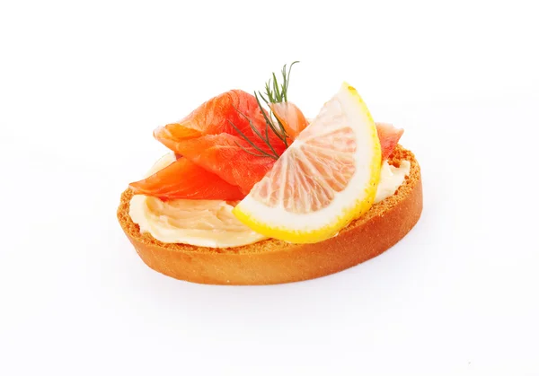 Canape with red fish and lemon — Stock Photo, Image