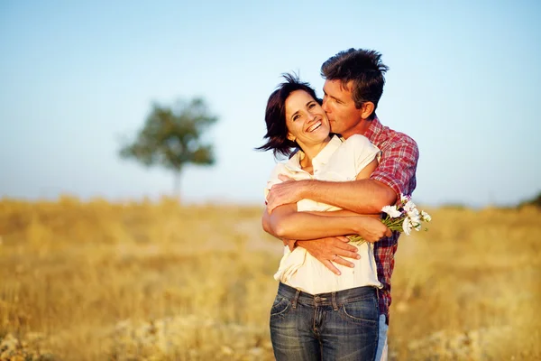 Happy couple on the field Stock Image