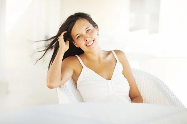 Casual but very feminine young woman at home — Stock Photo, Image