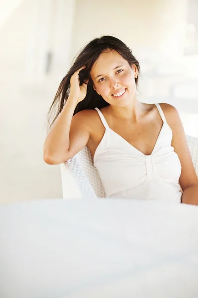 Casual but very feminine young woman at home — Stock Photo, Image