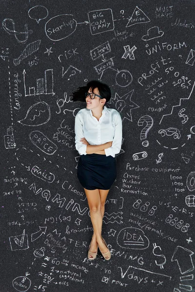 Business conceptual background: woman thinking on a project — Stock Photo, Image