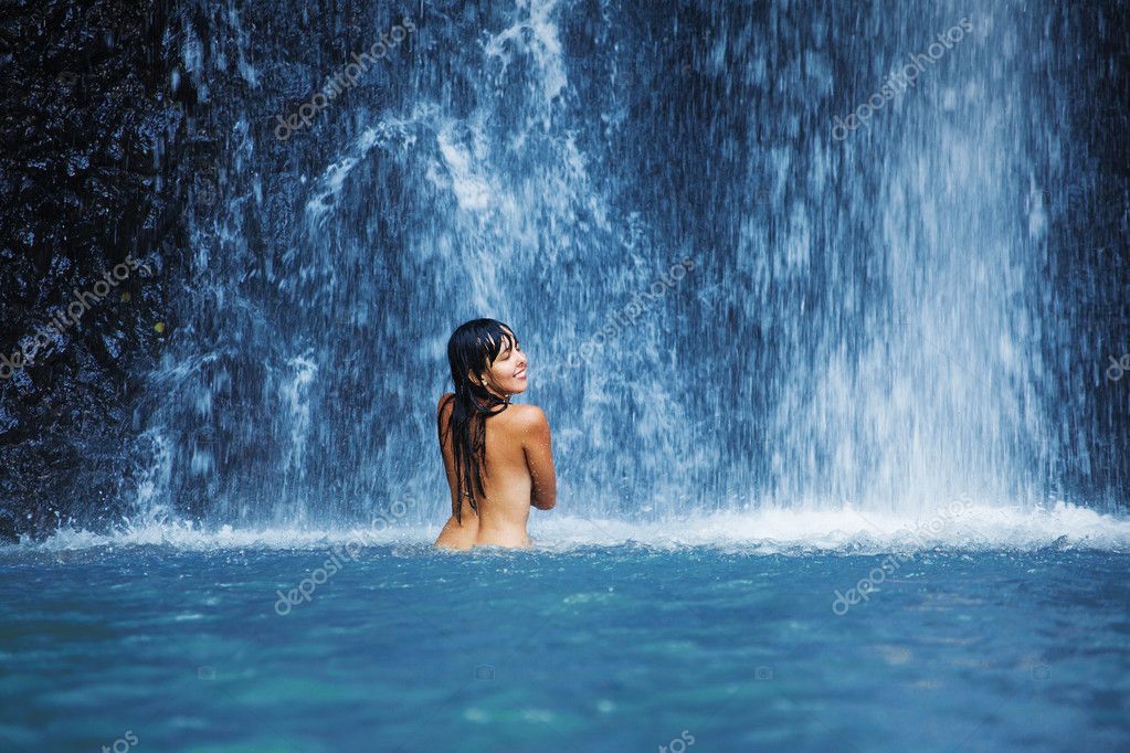 Naked woman washing in waterfall Stock Photo by ©apid 45505623 photo